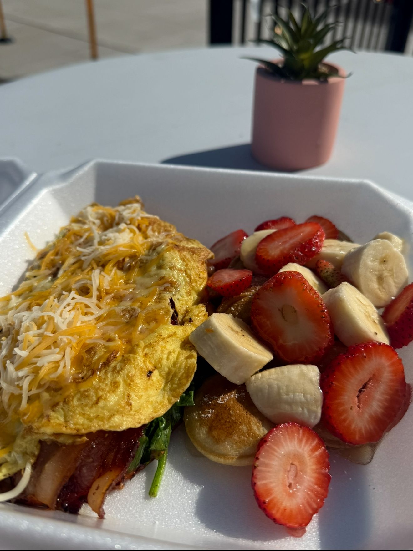 Combo 1 — omelette with cheese, bacon, spinach and fresh fruit with mini pancakes